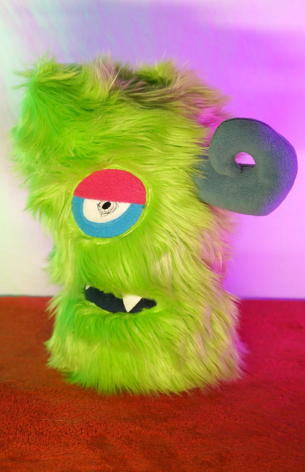 LARGE GREEN TWO EYED MONSTER WITH HORNS & POCKET MOUTH — TIM